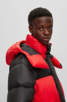 Water-repellent parka with red-rubber logo badge